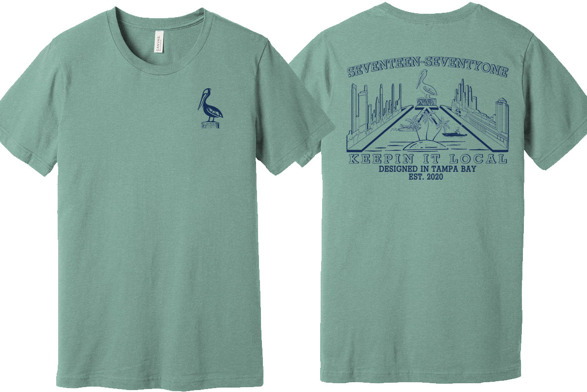 Green t shirt with the skyline of Tampa and St. Pete St. Petersburg with pelican in the middle