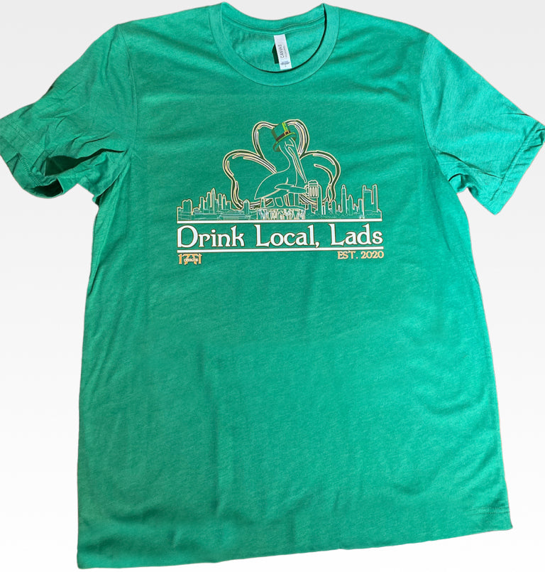 Green shirt featuring the tampa bay st.pete St. Petersbug skyline and pelican - locally made t shirt